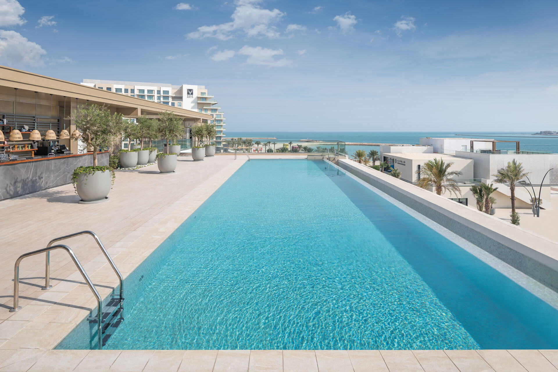 Vida Residences infinity pool overlooking the sea